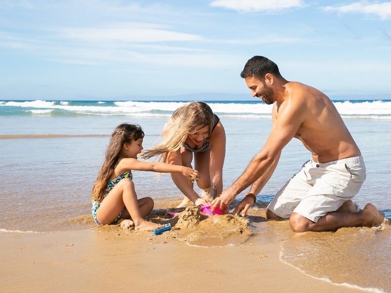 family enjoying the beach at grand velas riviera maya