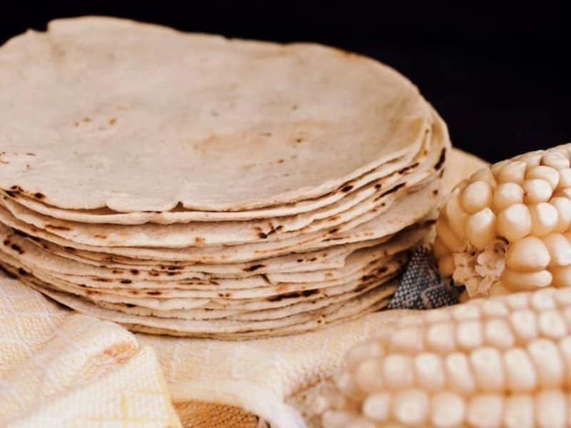 A stack of tortillas and corn