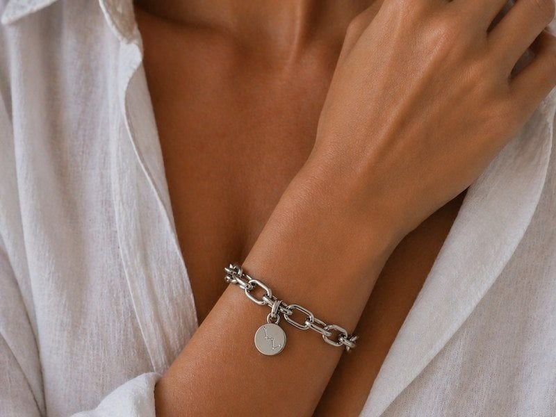 A woman wearing a silver bracelet